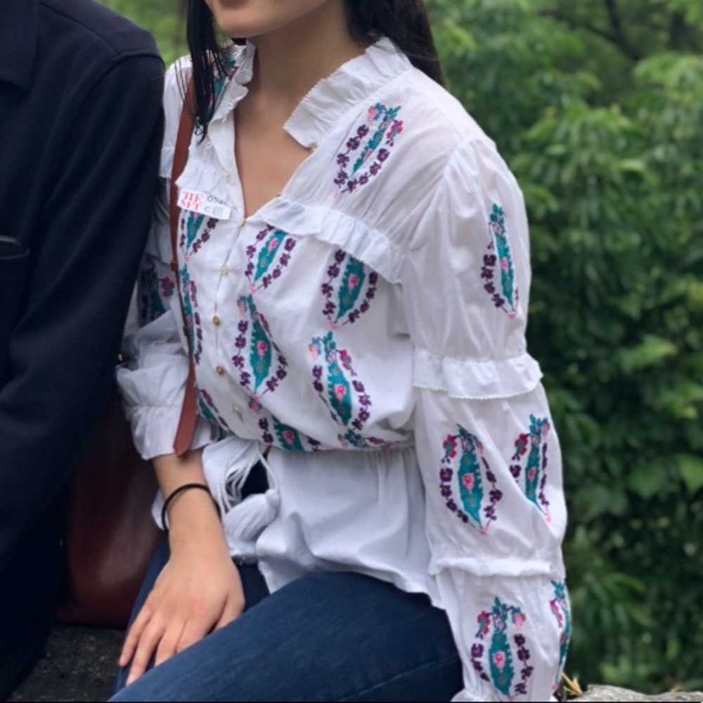 Embroidered peplum top with ruffles